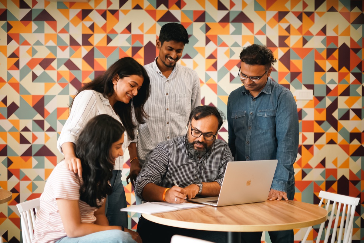 Coditas team collaborating at a desk